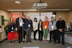 Group of participants and organizers standing for photo